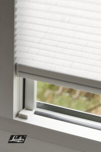 Close-up detail of TruFit blind precision mounting system on uPVC window frame showing no-drill installation