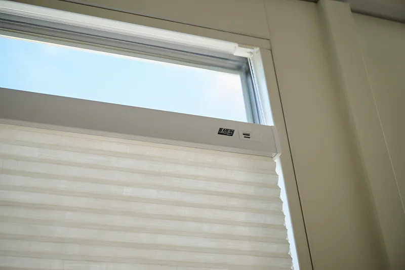 DuoMotion blind filtering soft daylight into a bedroom