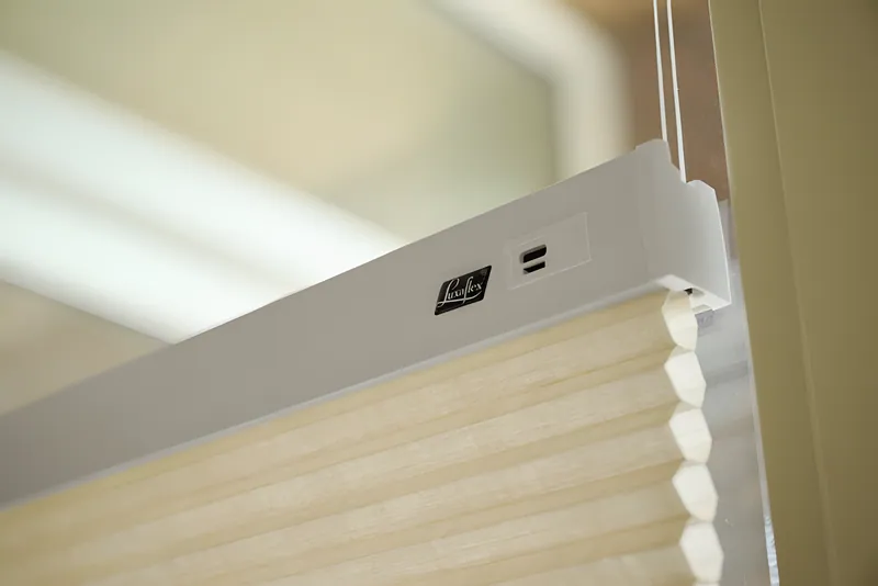 DuoMotion blind partly lowered from the top of the window