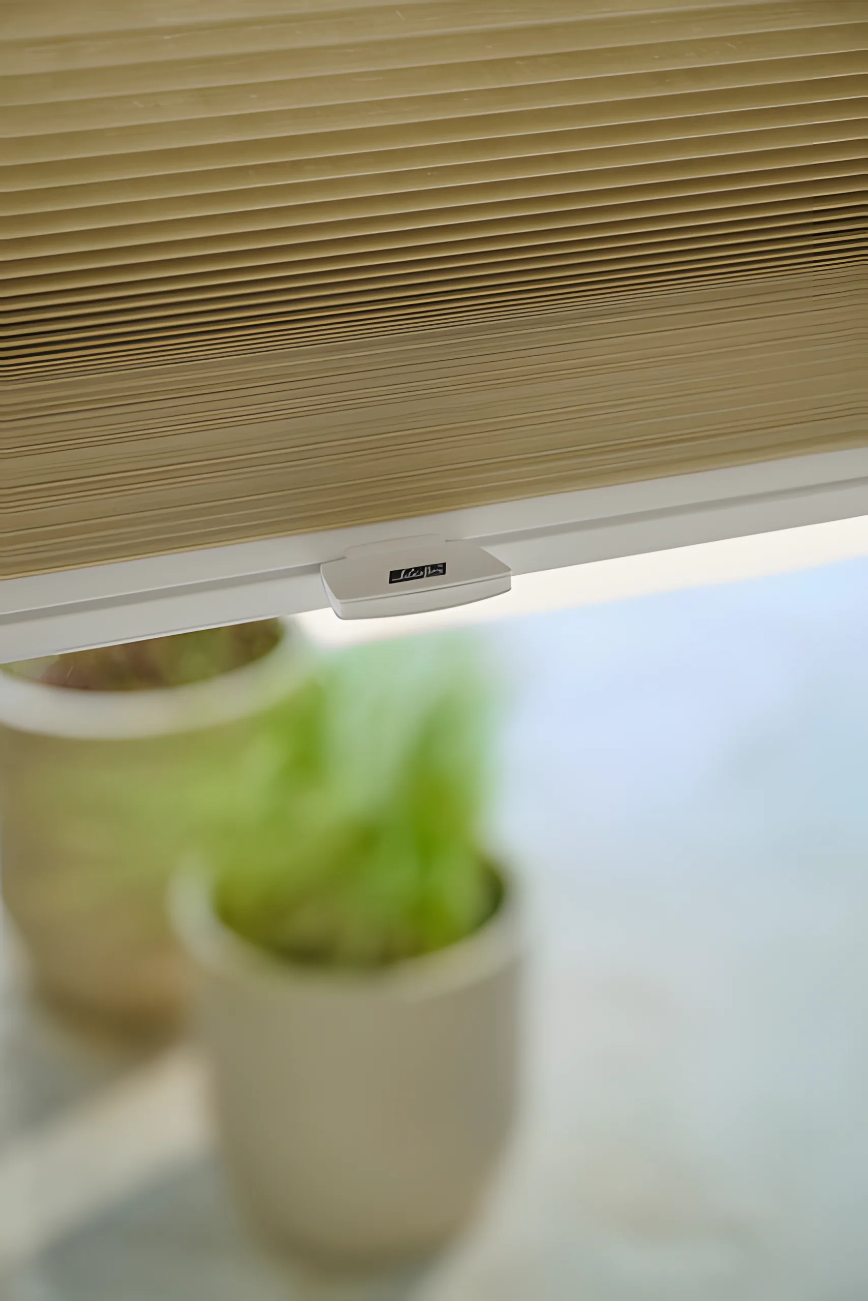 Luxaflex PowerView remote being used to operate a DuoMotion blind