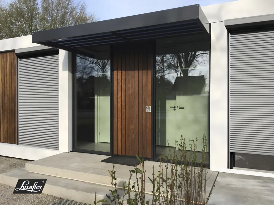 Luxaflex external aluminium roller shutters fitted over large windows on a modern home