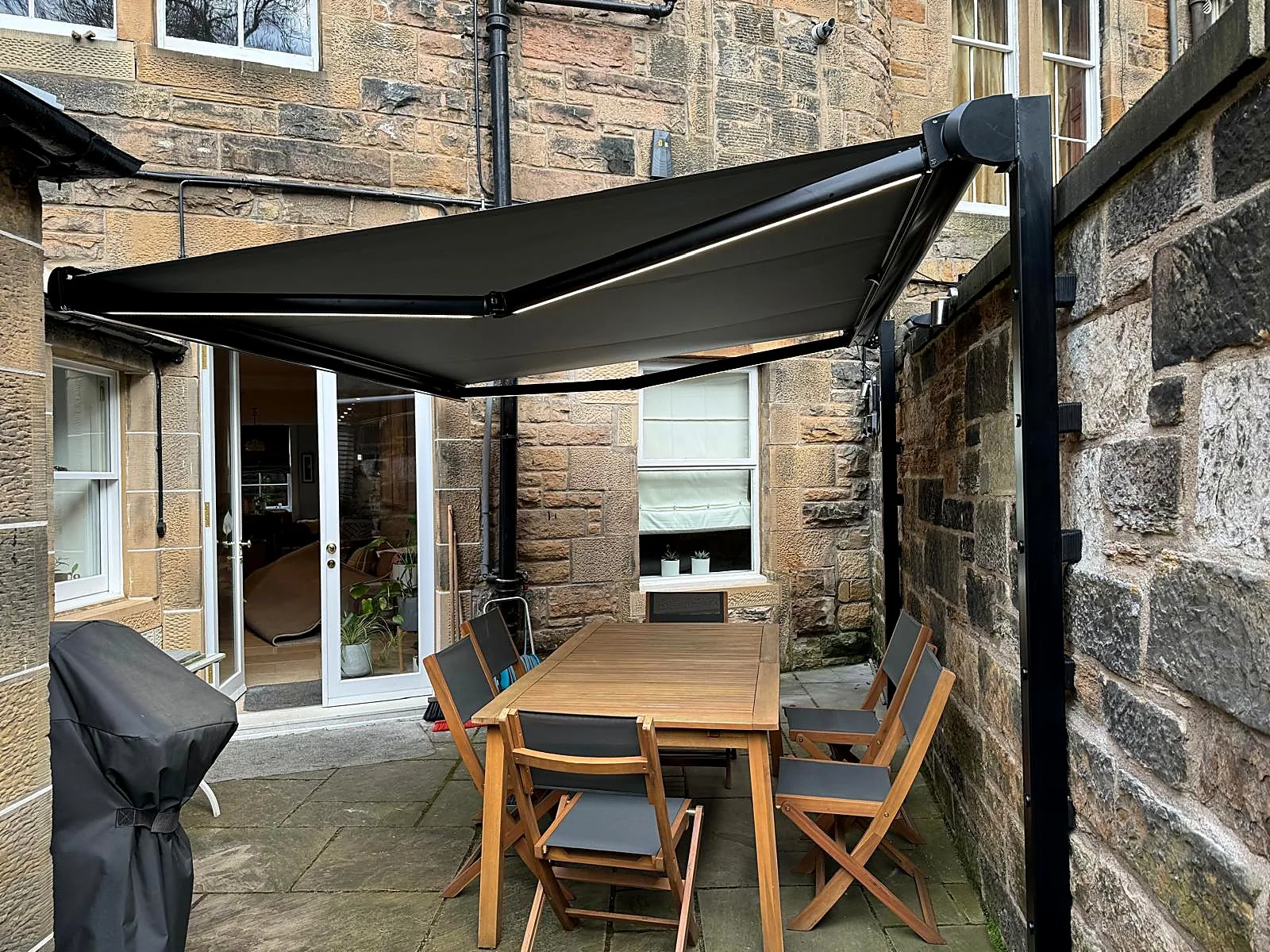 Retractable awning over patio area