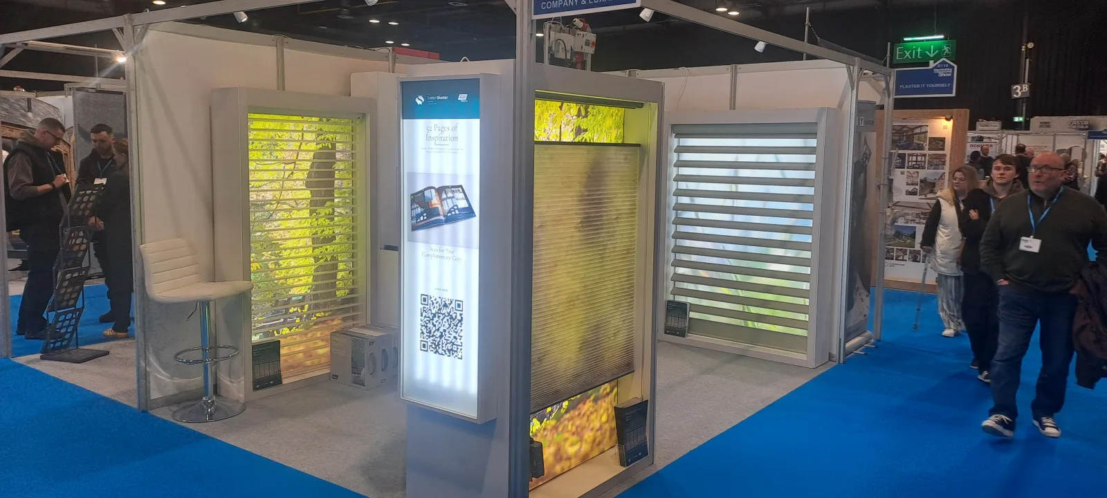 The Scottish Shutter Company and Luxaflex joint stand at the Homebuilding and Renovating Show, SEC Glasgow, with visitors browsing the displays