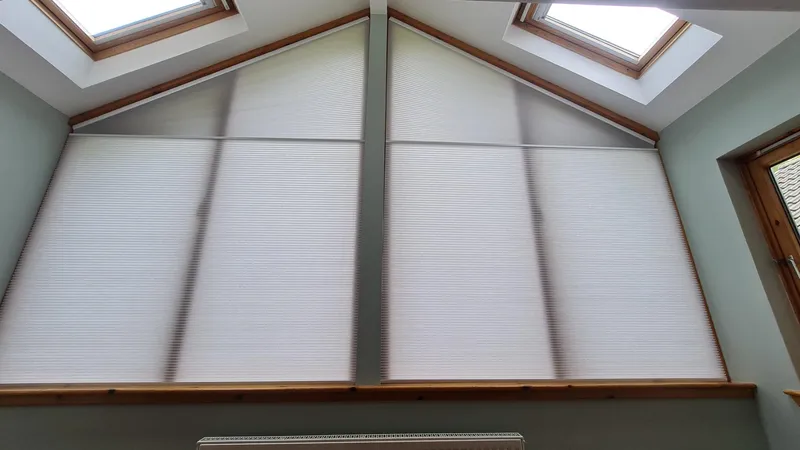 Motorised gable blind installed in a shaped window