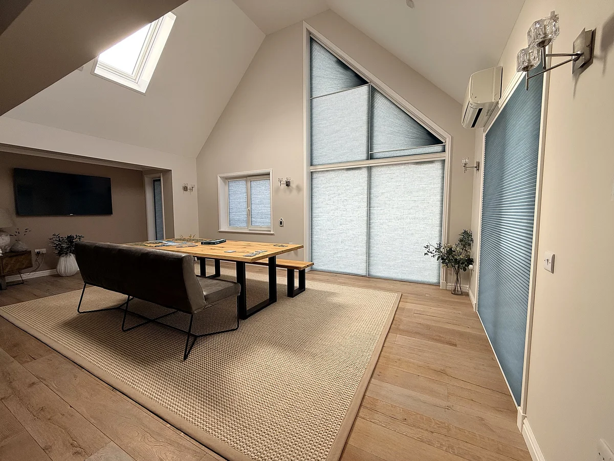 Triangular gable cellular blinds fitted to a modern dining room