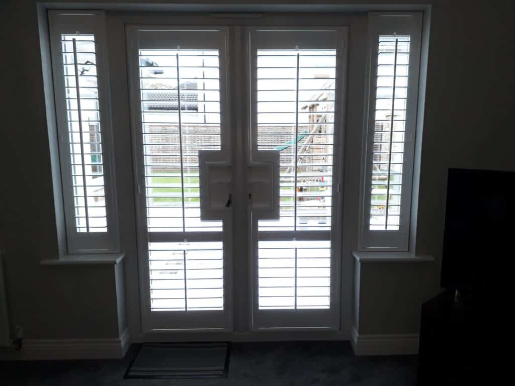 Window Shutters with a French Door Cutout for the Door Handle