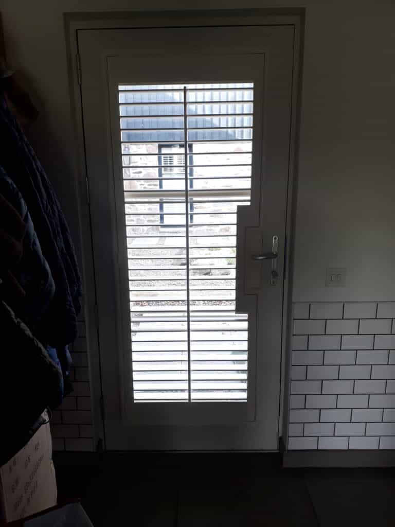 Window Shutters with a French Door Cutout for the Door Handle