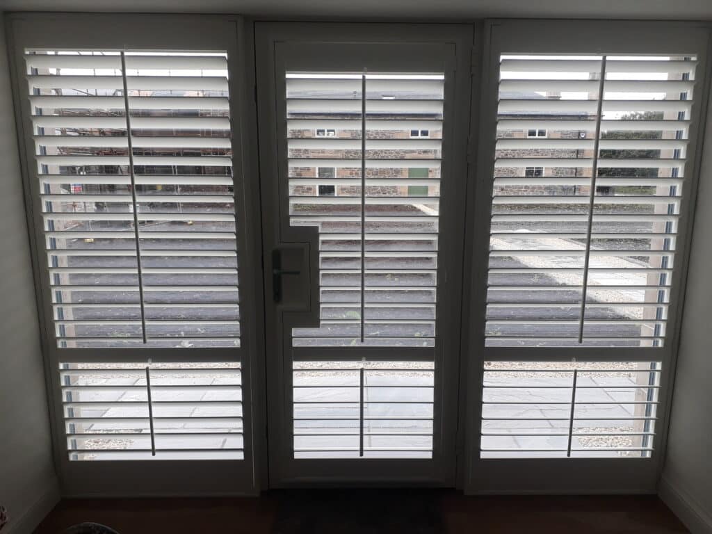 Window Shutters with a French Door Cutout for the Door Handle