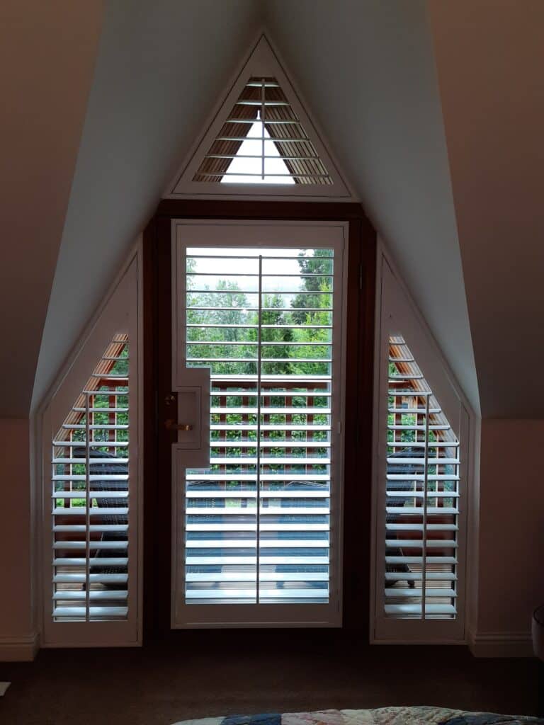Window Shutters with a French Door Cutout for the Door Handle