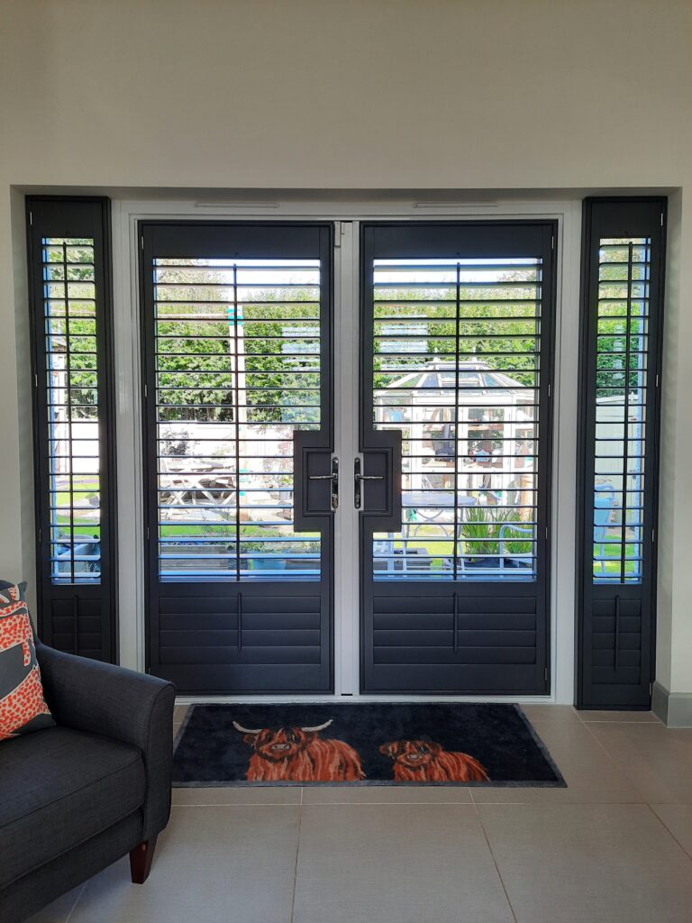 Window Shutters with a French Door Cutout for the Door Handle