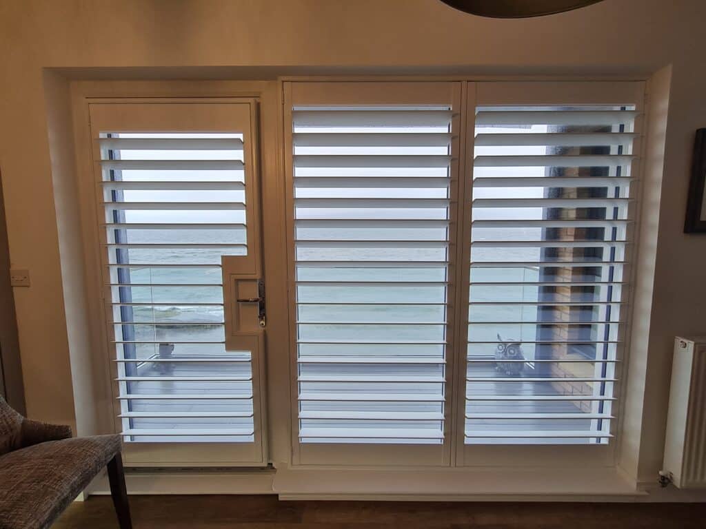 Window Shutters with a French Door Cutout for the Door Handle