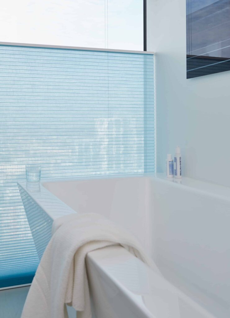 Bottom-up, transparent Duette blinds in a bathroom - The Scottish Shutter Company