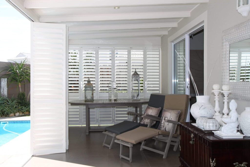 External Satin White Portchester Security Shutters in a Sun Lounge