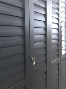 Portchester Security Shutters for Your Home 🏠 2 Portchester Security Shutters on a Patio Door in Charcoal from The Scottish Shutter Company