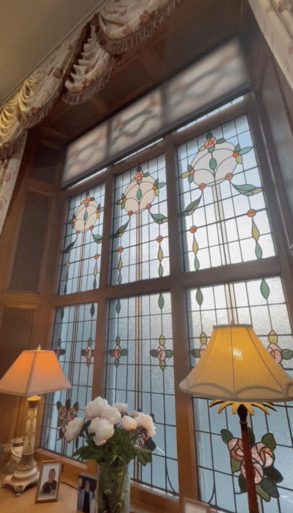 A Luxaflex Duette motorised blind helping to insulate a large stained glass window - The Scottish Shutter Company