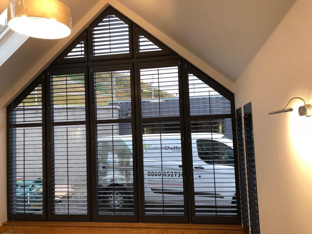 Custom Window Shutters on a trapezoidal gable window